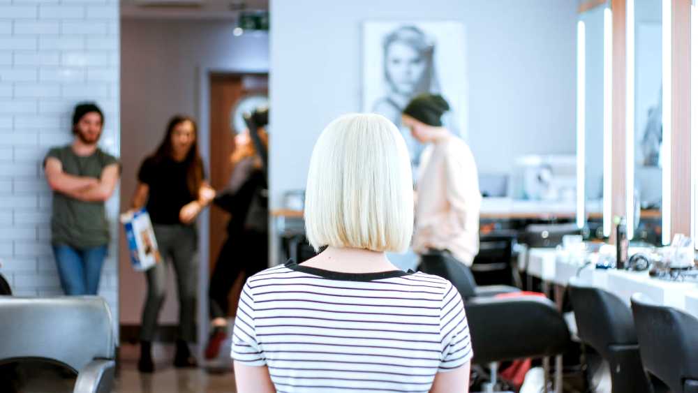 salon interior with focus on patrons completed hair style