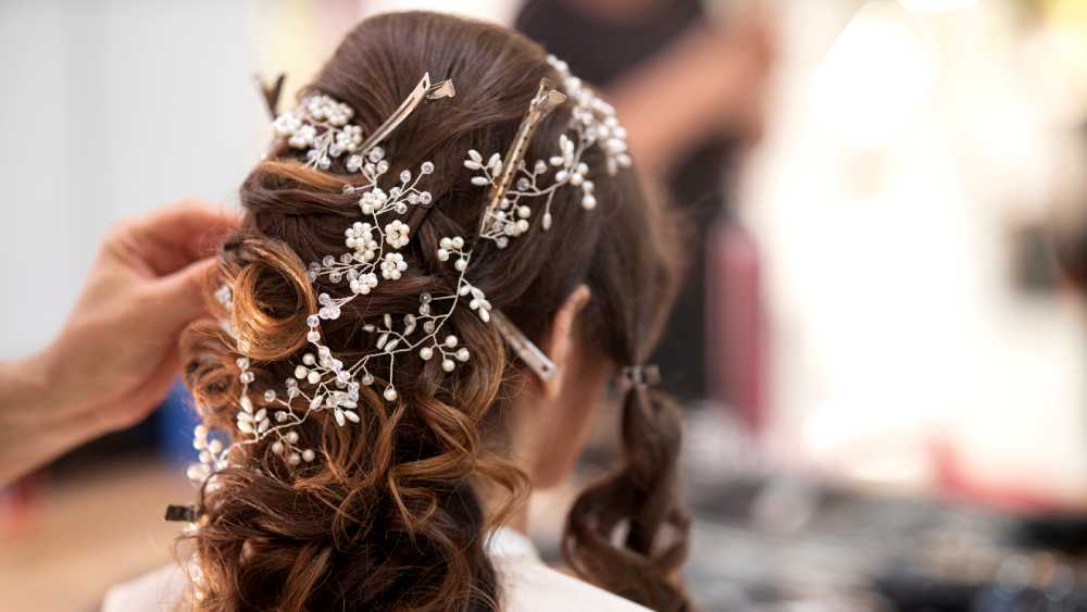 person getting their hair styled